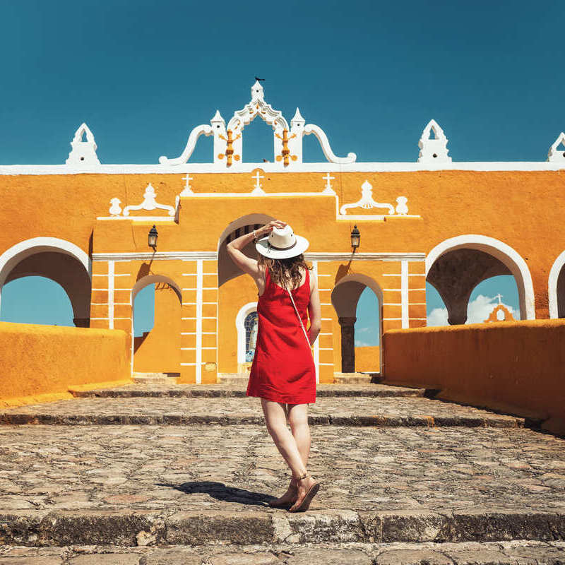 Young Female Tourist In Izamal, The Yellow Town Of Yucatan, Mexico