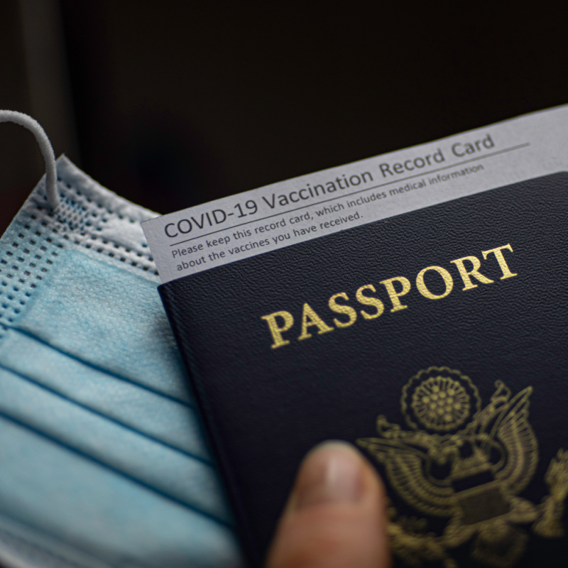 Passport With Vaccination Record And Mask