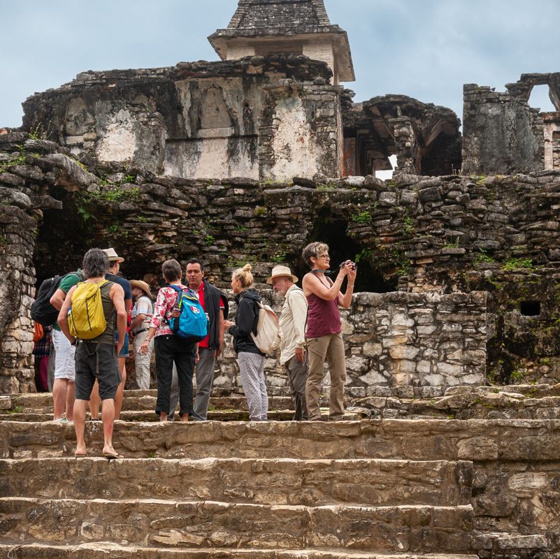 Group Of Tourists In The Mayan Ruins