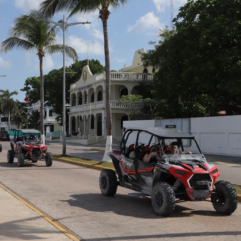 Beach Buggy Tour Group Driving On A Road In Mexico