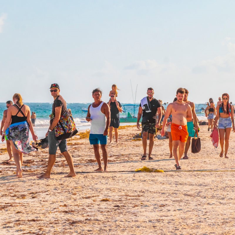 Tourists On A Beach In Tulum, Mexico