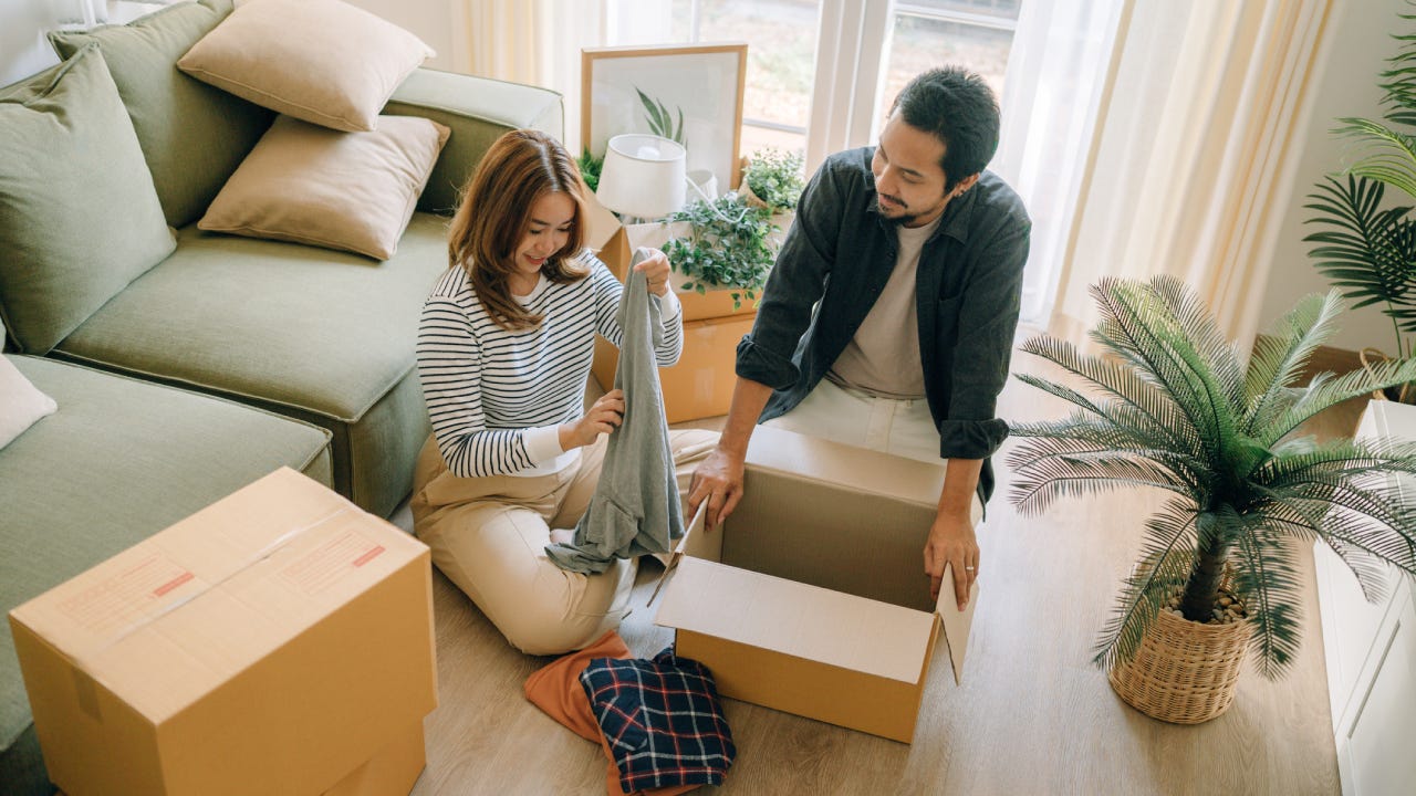 Happy couple moving to a new house