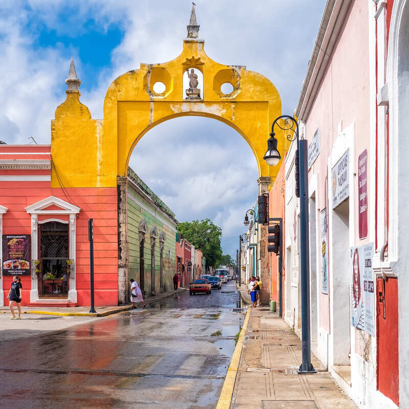 Yellow Colonial Arch In Merida, A Colonial-Era City In Mexico'S Yucatan Peninsula